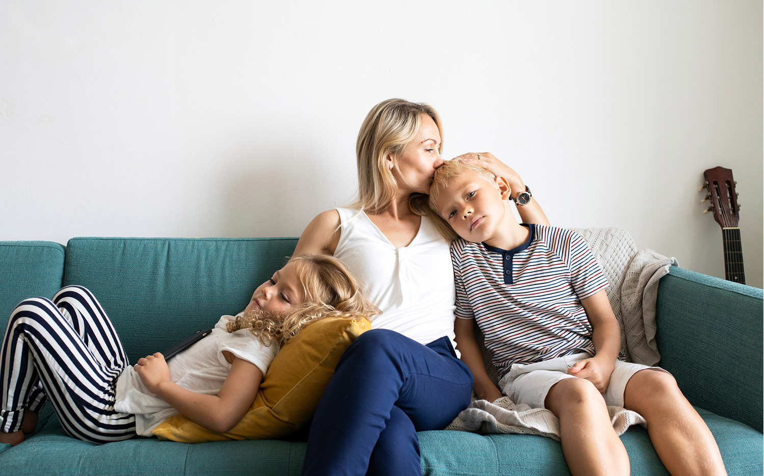 mother and children on a couch together